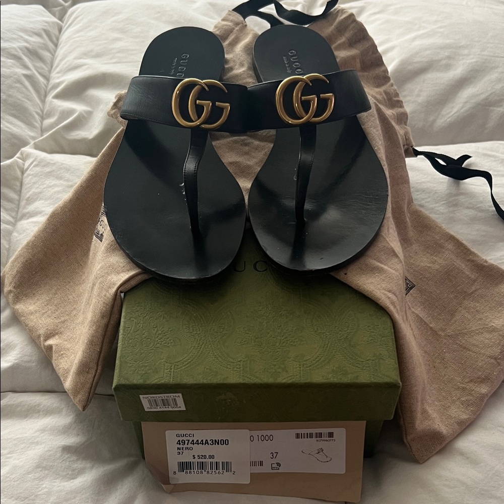 Gucci Black Slides with Gold Emblem